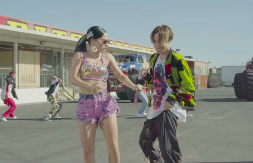 Becky G, left, and J-Hope in the music video for their collaboration "Chicken Noodle Soup."