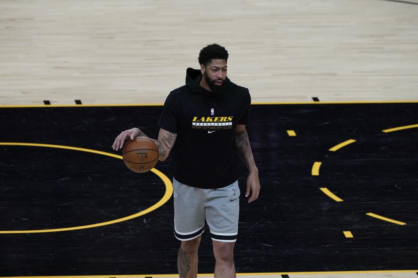 Los Angeles Lakers forward Anthony Davis warms up prior to Game 5 of an NBA basketball first-round playoff series against the Phoenix Suns, Tuesday, June 1, 2021, in Phoenix. (AP Photo/Matt York)