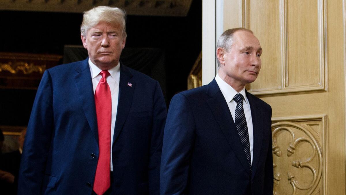 President Trump and Russian President Vladimir Putin arrive for a meeting in Helsinki on July 16, 2018.
