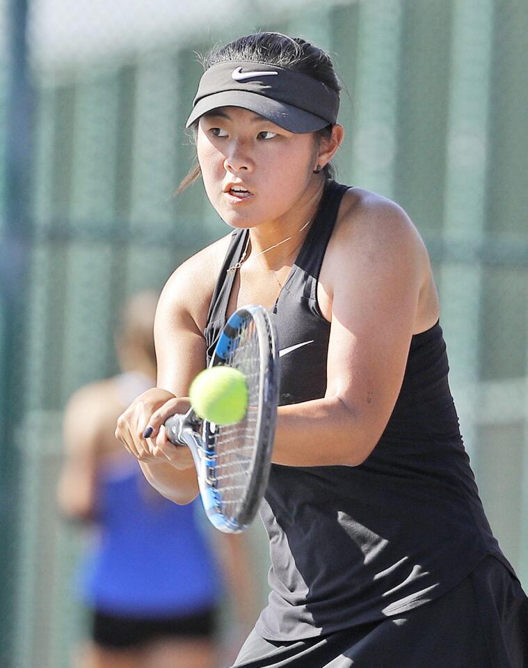 Glendale's Kristen Lee hats a backhand return in a singles match against Burbank in a Pacific League girls' tennis match at Burbank High School in Burbank on Thursday, September 13, 2018. Glendale is defending its 2017 CIF girls championship victory.