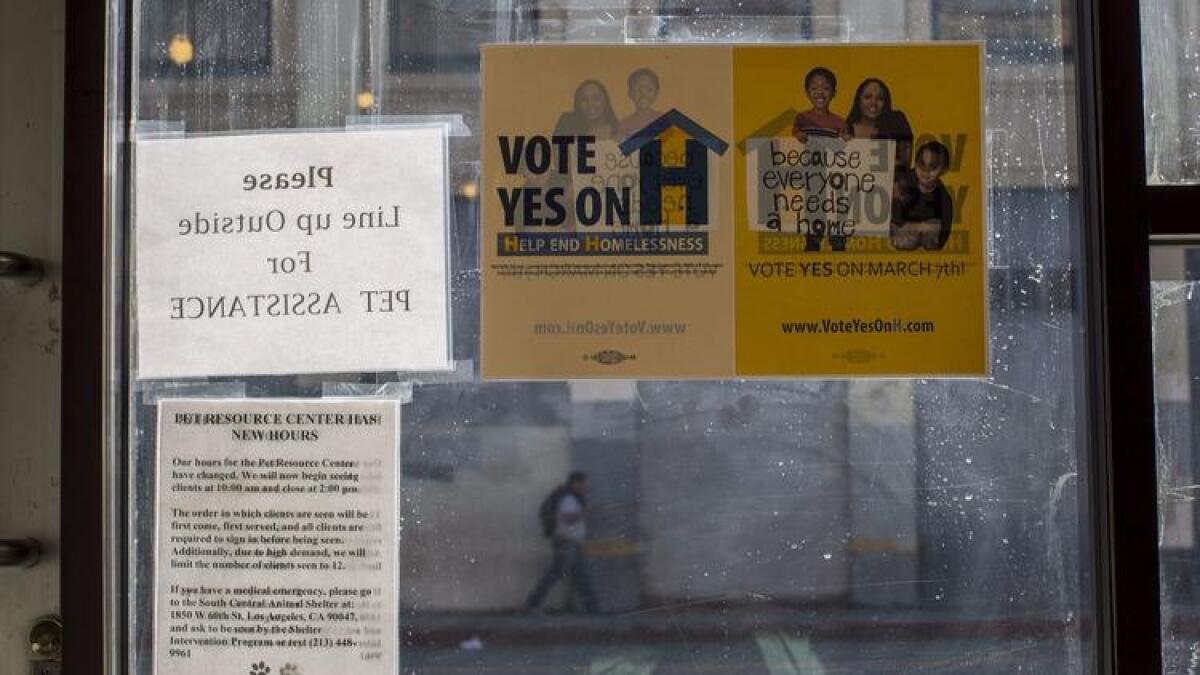 A sign urging support for Measure H, the countywide sales tax increase to benefit anti-homelessness efforts, inside the Inner City Law Center on skid row.
