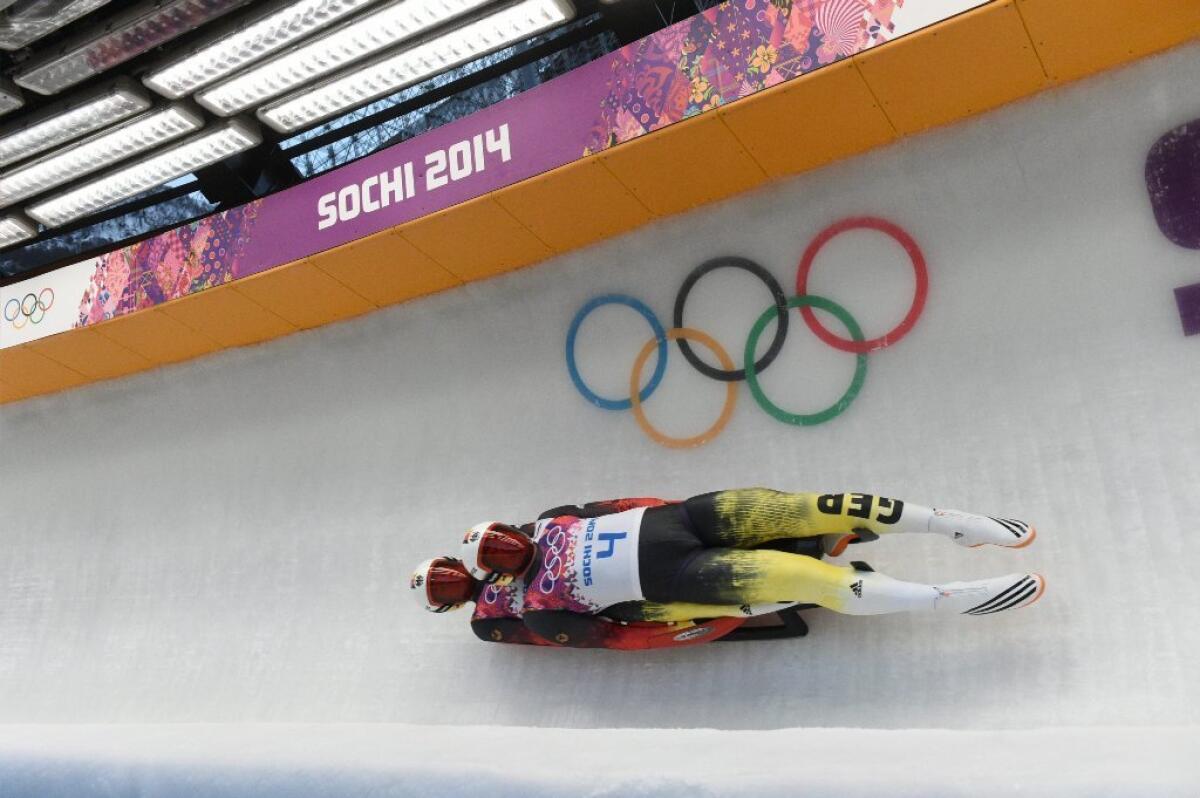Tobias Wendl and Tobias Arlt of Germany during the first run of the men's doubles luge competition at Sochi.