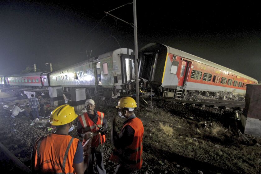 Rescuers work at the site of passenger trains accident, in Balasore district, in the eastern Indian state of Orissa, Saturday, June 3, 2023. Two passenger trains derailed in India, killing more than 200 people and trapping hundreds of others inside more than a dozen damaged rail cars, officials said. (AP Photo)