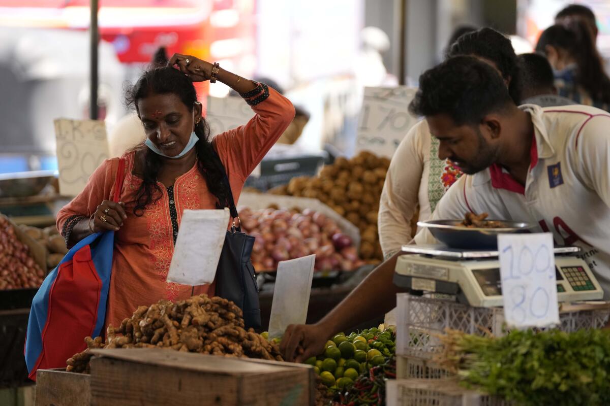 Woman shopping in vegetable market