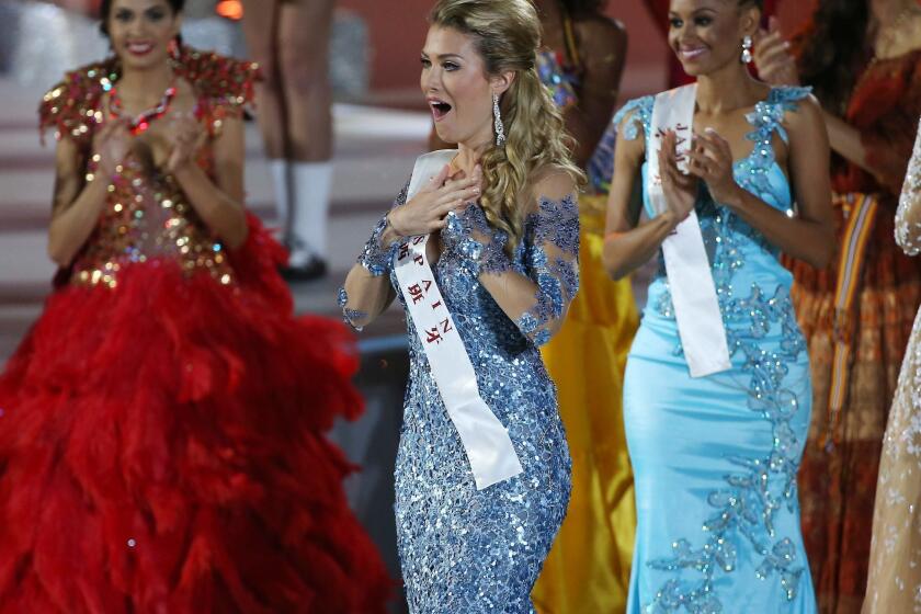 Mireia Lalaguna Royo of Spain, center, was named Miss World in a competition clouded by controversy in Sanya, China, on Dec. 19, 2015.