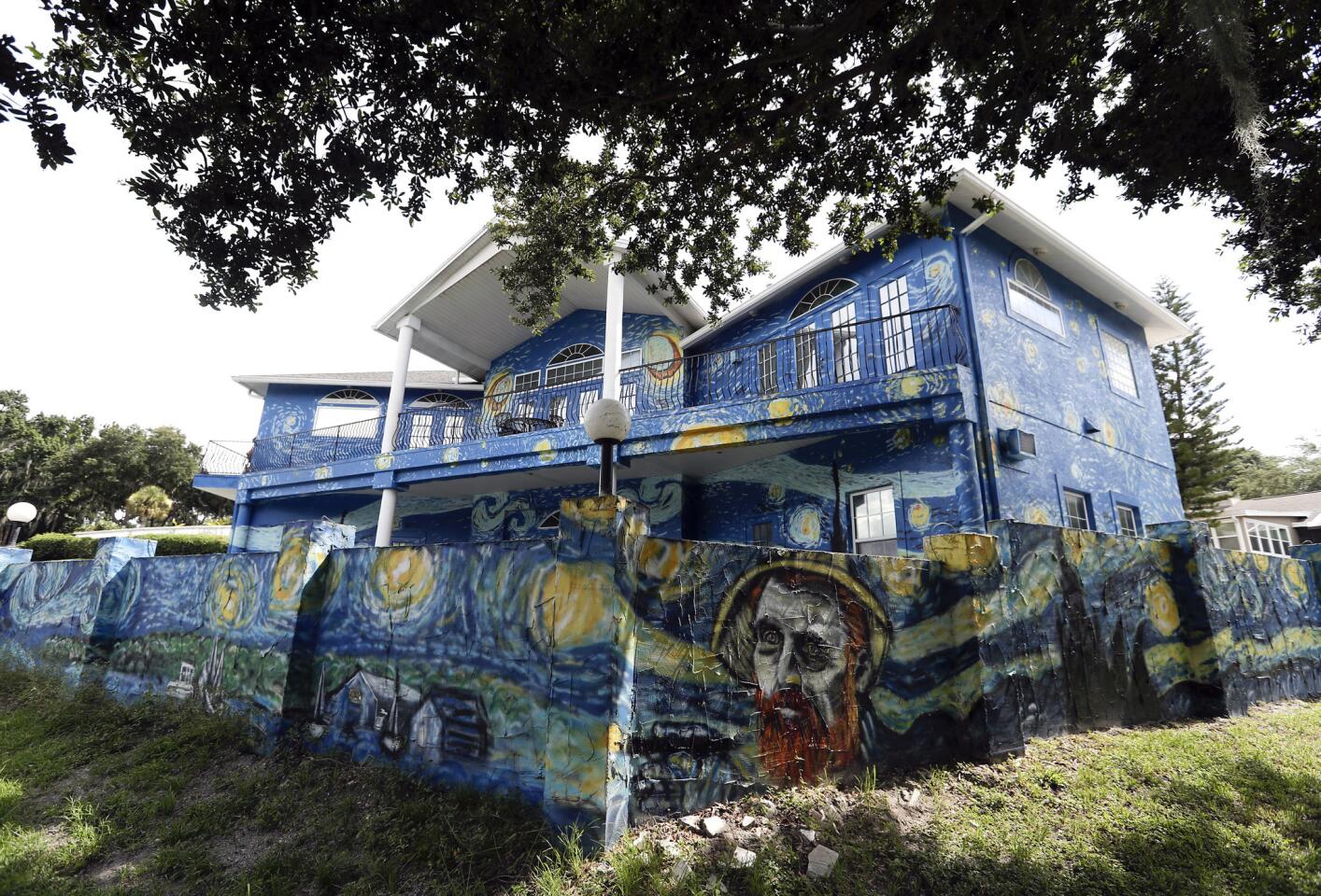 This Wednesday, July 18, 2018 photo shows the painted exterior of the home of Lubomir Jastrzebski and Nancy Memhauseer in Mount Dora, Fla.