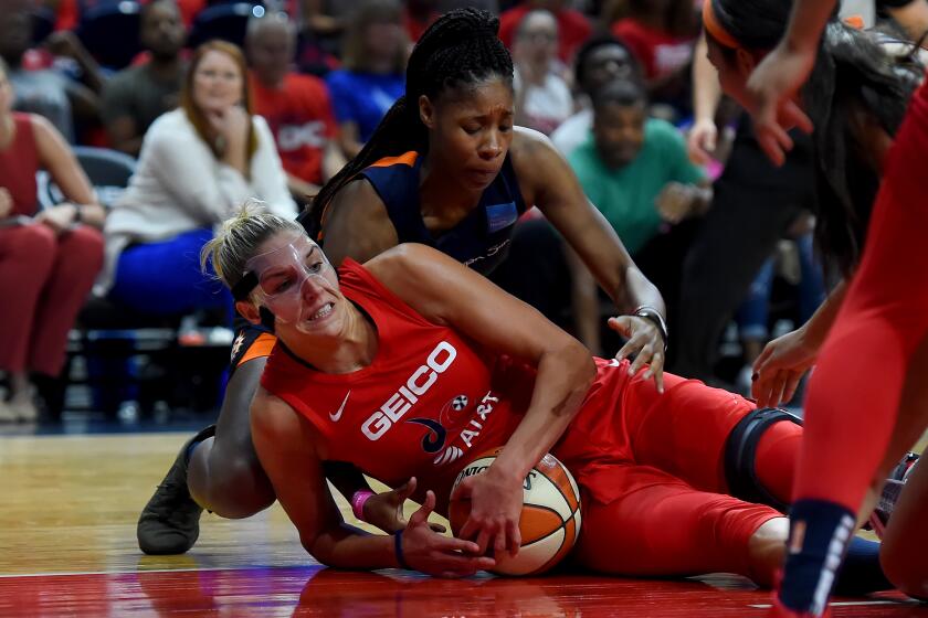WASHINGTON, DC - SEPTEMBER 29: Elena Delle Donne #11 of the Washington Mystics battles Jonquel Jones #35 of the Connecticut Sun for the ball during the first half of WNBA Finals Game One at St Elizabeths East Entertainment & Sports Arena on September 29, 2019 in Washington, DC. NOTE TO USER: User expressly acknowledges and agrees that, by downloading and or using this photograph, User is consenting to the terms and conditions of the Getty Images License Agreement. (Photo by Will Newton/Getty Images)