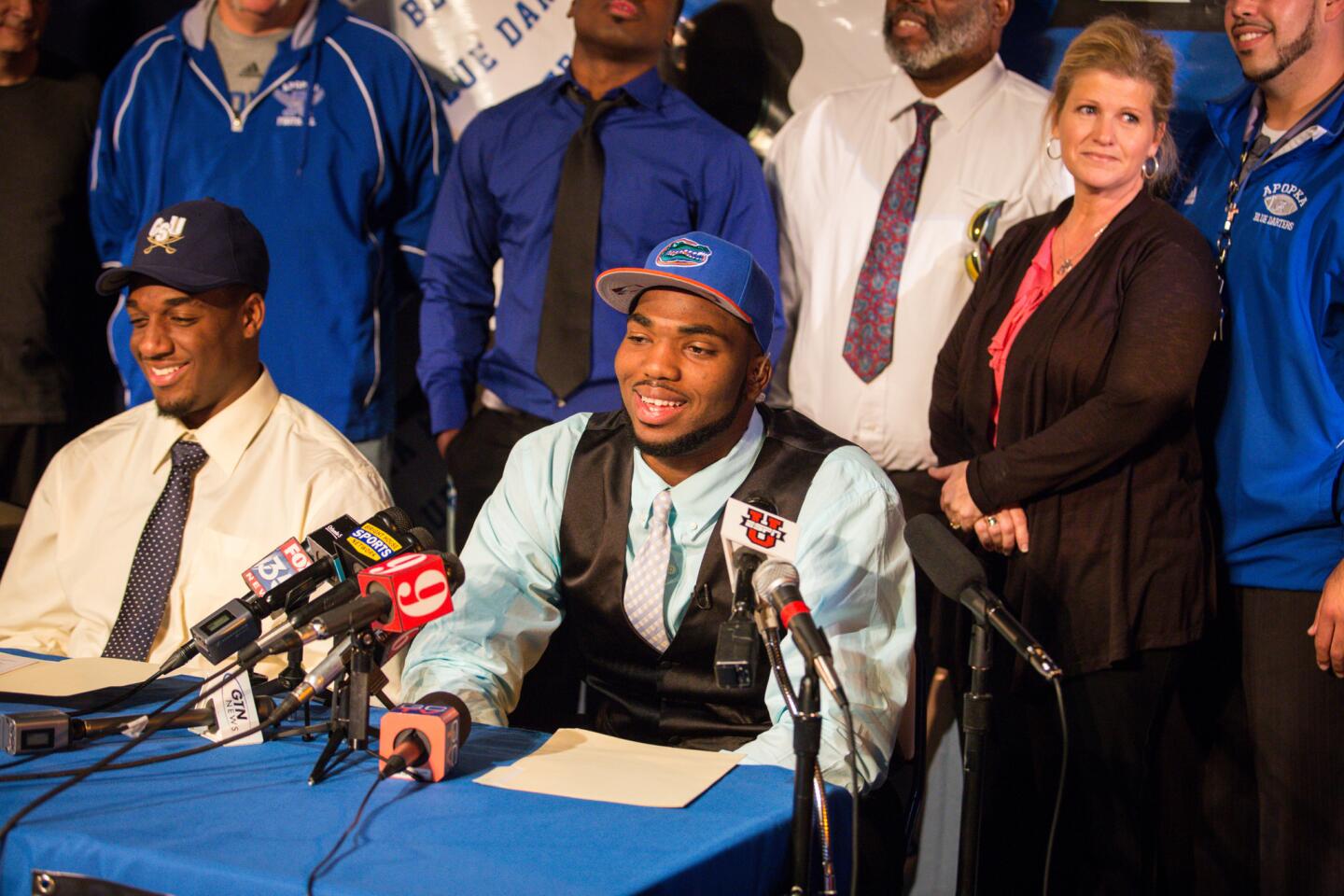 Martez Ivey signs with the University of Florida at a National Signing Day ceremony at Apopka High School in Apopka, Fla. on Wednesday, February 04, 2015.