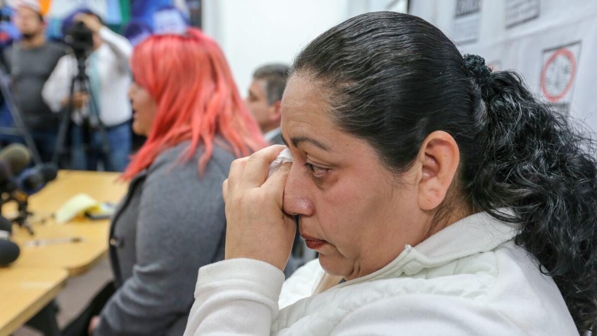 Rosa Robles, mother of Jesus Alonso Arreola Robles, wipes her tears at a news conference in Los Angeles on Thursday.