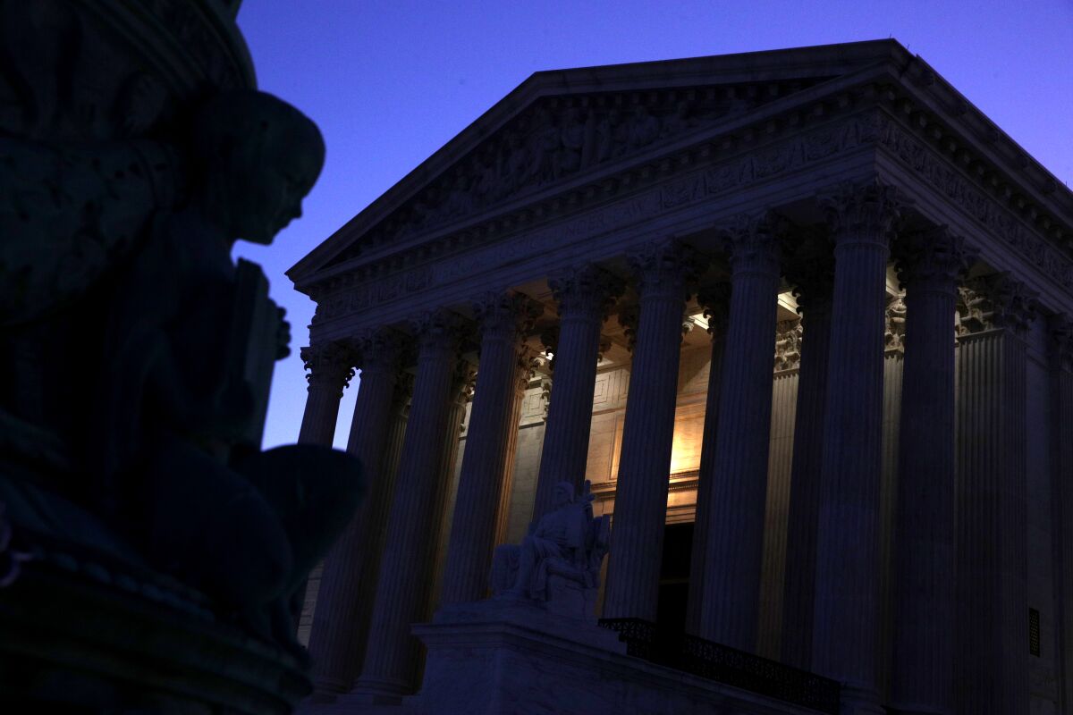 Lights glows from the U.S. Supreme Court building in Washington during the early morning hours of Sept. 16, 2019.