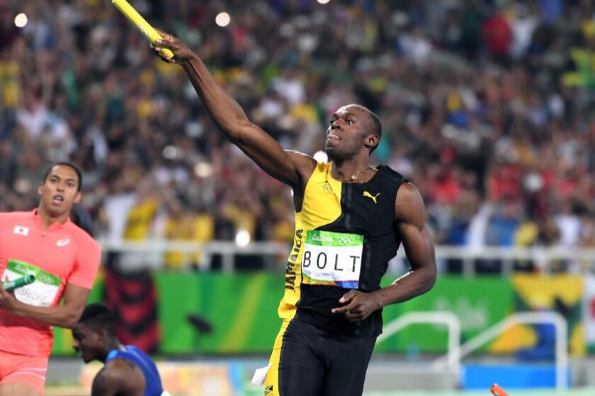 Usain Bolt of Jamaica celebrates after winning the gold medal in the men's 400-meter relay on Aug. 19.