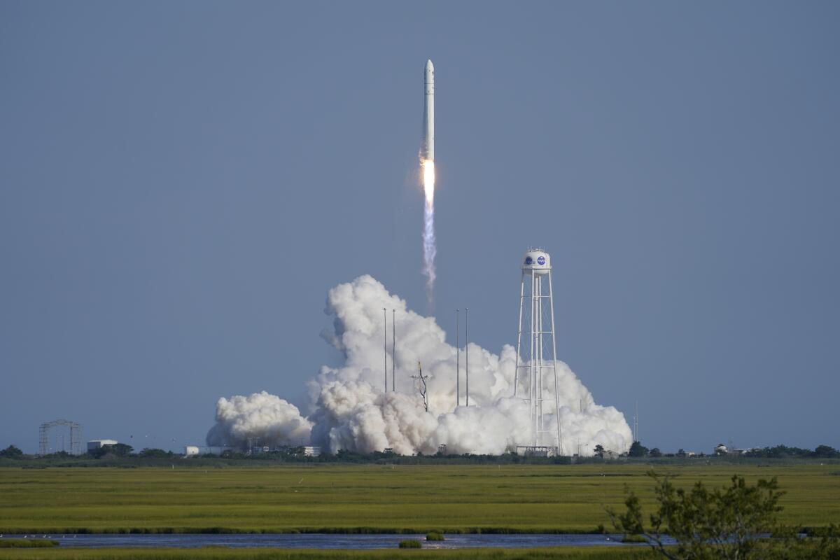 Northrop Grumman's Antares rocket lifts off the launch pad at the NASA Test Flight Facility, Tuesday, Aug. 10, 2021, in Wallops Island, Va. The rocket carries a Cygnus space vessel that will deliver supplies to the International Space Station. (AP Photo/Steve Helber)