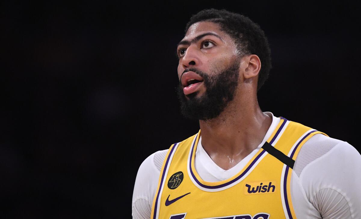 Lakers forward Anthony Davis was still experiencing discomfort Tuesday after being poked in the eye during a scrimmage.