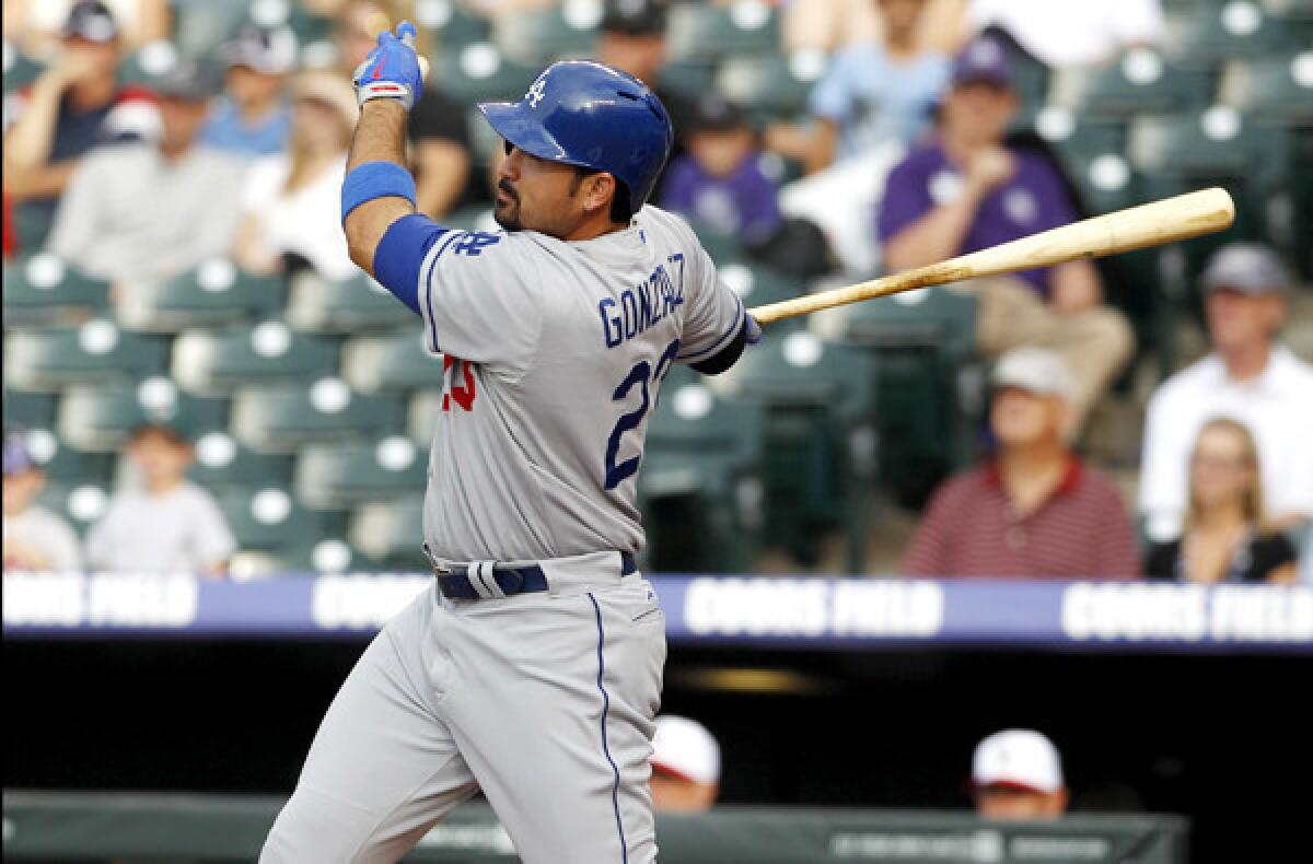 Dodgers first baseman Adrian Gonzalez follows through on a single against the Colorado Rockies in the first inning Thursday.