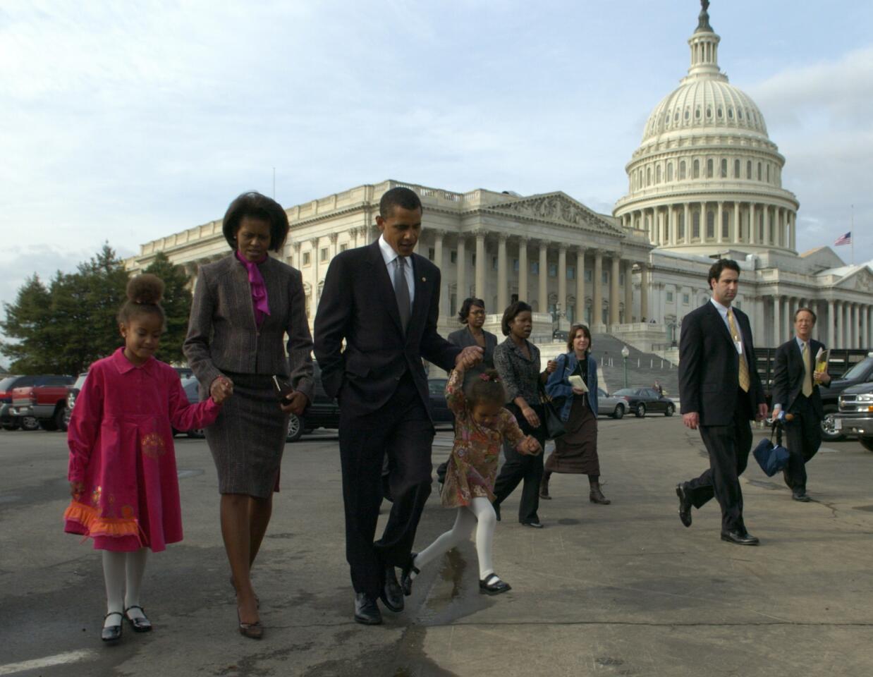 Sen. Barack Obama walks from the U.S. Capitol with his wife, Michelle, and their daughters, Malia, 6, left, and Sasha, 3, to a reception after his swearing-in.
