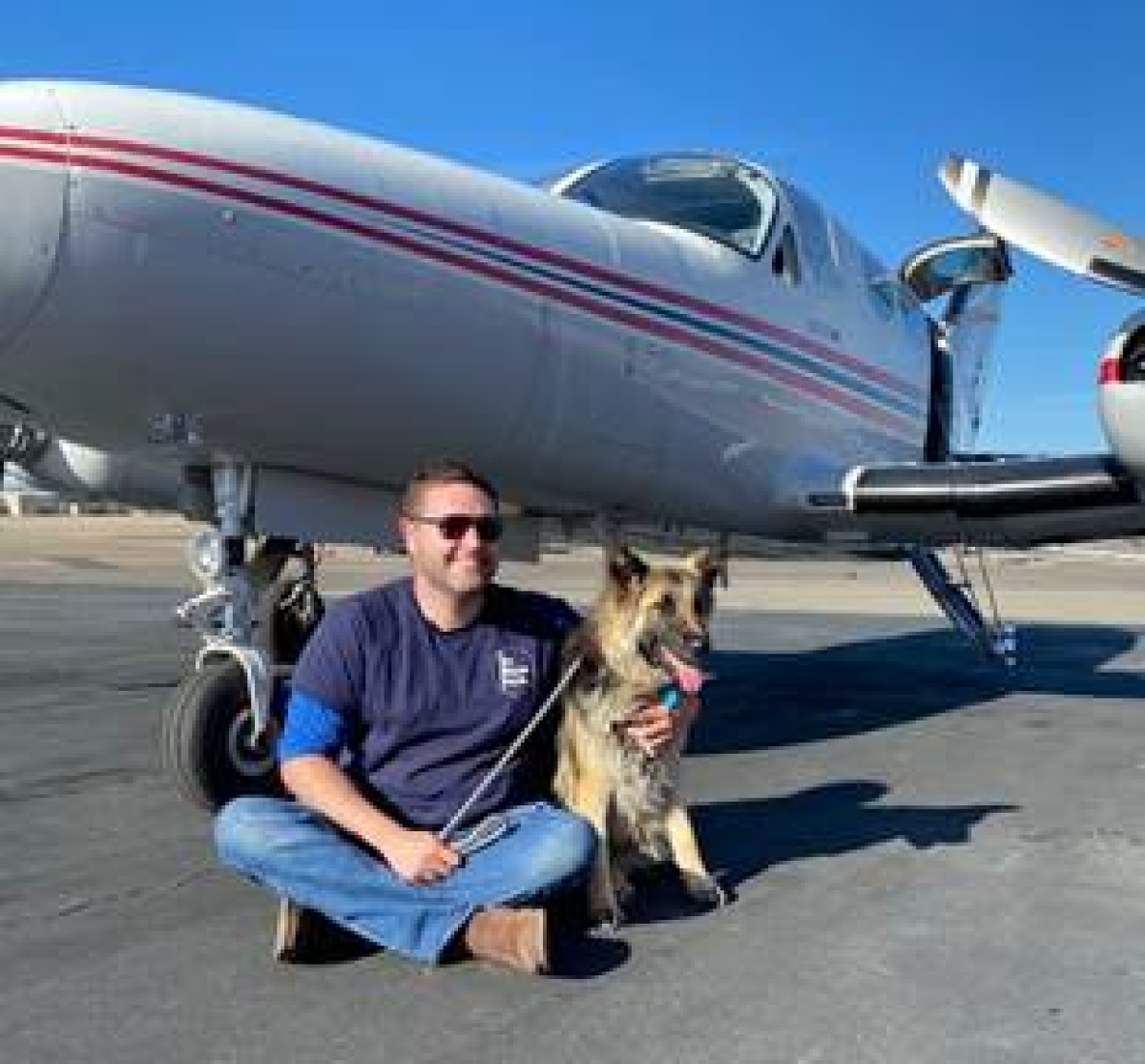 Chloe with a pilot from the rescue group Pilots for Paws.