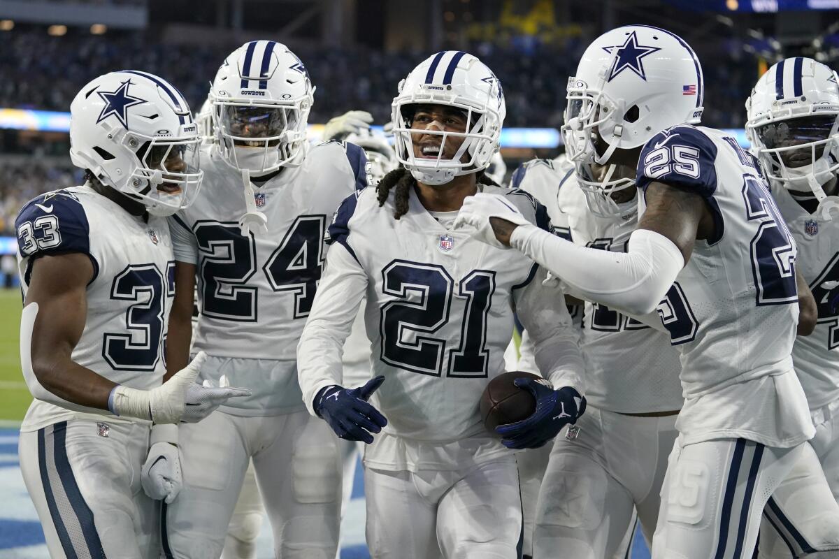 Dallas Cowboys cornerback Stephon Gilmore (21) celebrates with his teammates after intercepting a pass during the fourth quarter of an NFL football game against the Los Angeles Chargers, Monday, Oct. 16, 2023, in Inglewood, Calif. (AP Photo/Ashley Landis)