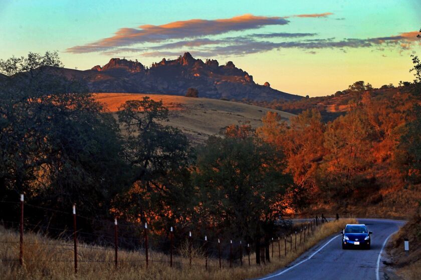 A sunset view of the west entrance of Pinnacles National Park on California 146. In some places, the winding and narrow road is one lane wide.