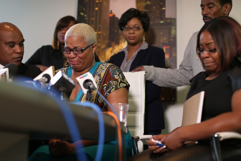 Sandra Bland's sisters hold a news conference in Chicago on Thursday. Her oldest sister, Shante Needham, is shown at center. At right is Sierra Cole, and in back, from left, are Shavon Bland and Sharon Cooper. Also shown is their attorney, Cannon Lambert, left, and their uncle, Paul Needham, back right.