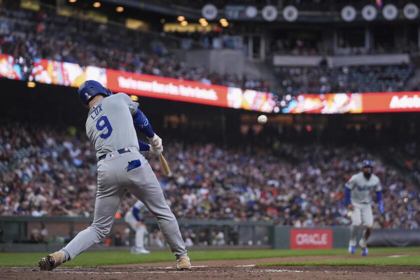 Los Angeles Dodgers' Gavin Lux hits an RBI triple against the San Francisco Giants during the fourth inning of a baseball game Tuesday, May 14, 2024, in San Francisco. (AP Photo/Godofredo A. Vásquez)