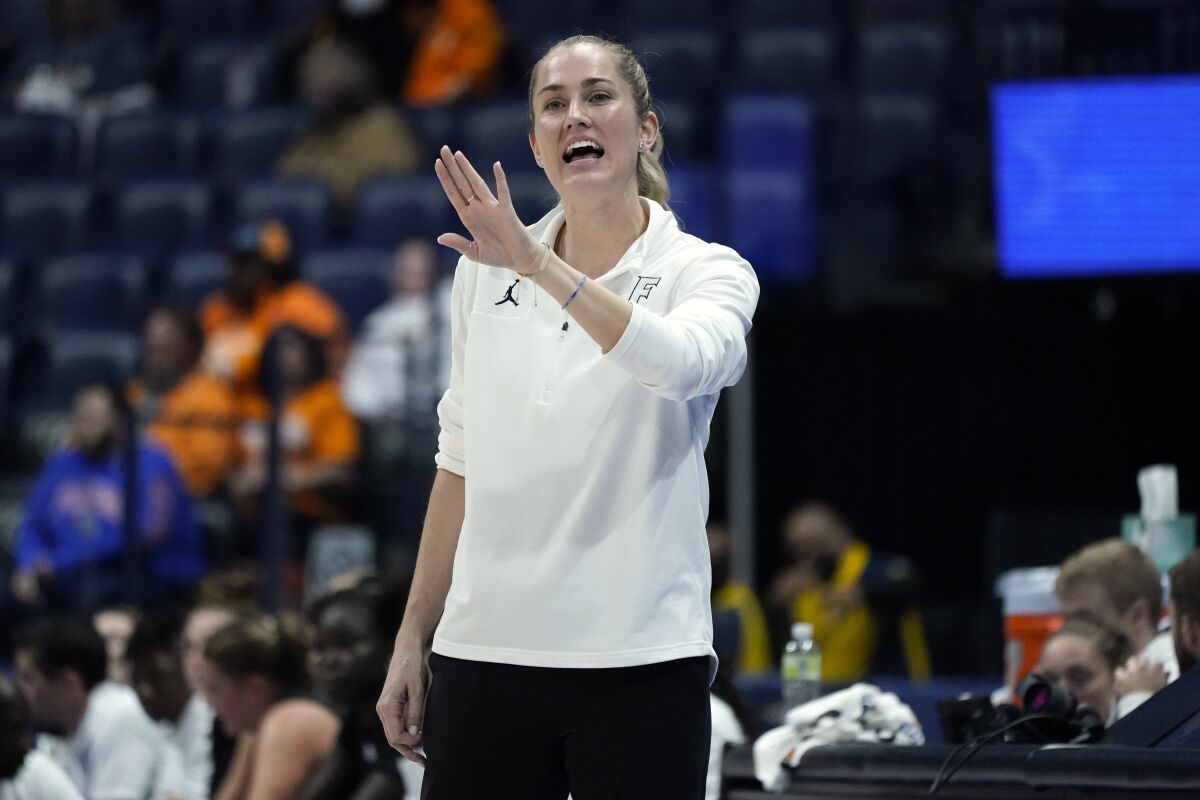 Florida head coach Kelly Rae Finley directs her players in an NCAA college basketball game against Mississippi at the women's Southeastern Conference tournament Friday, March 4, 2022, in Nashville, Tenn. (AP Photo/Mark Humphrey)