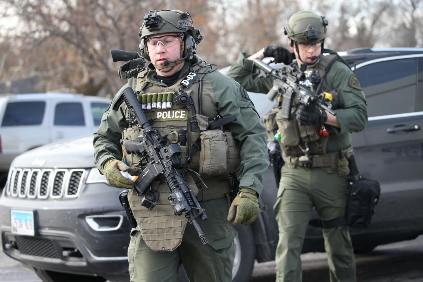 Police outside the manufacturing warehouse. Authorities said the gunman was shot and killed.