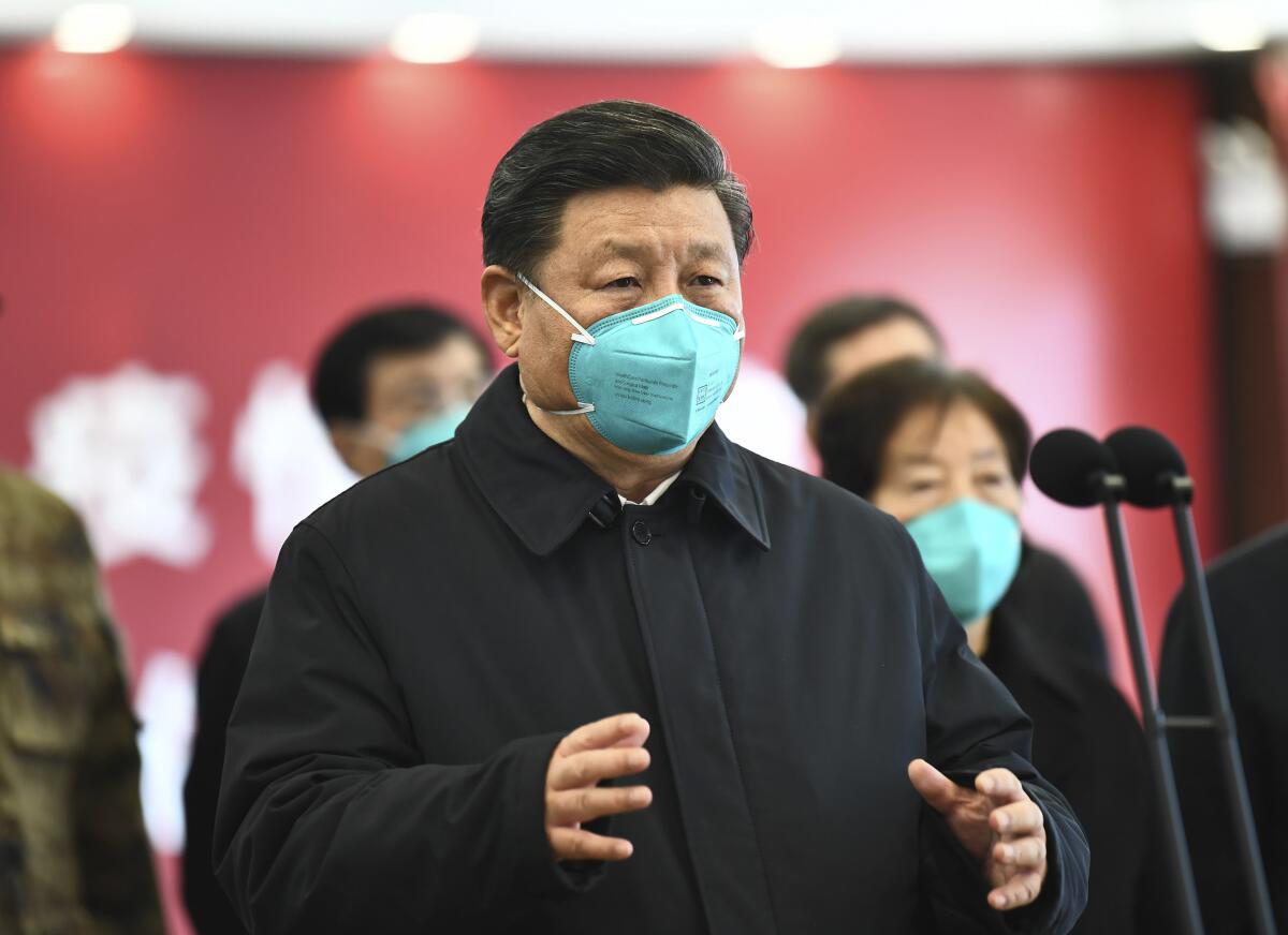 Chinese President Xi Jinping talks by video with patients and medical workers at a hospital in Wuhan on March 10, 2020.