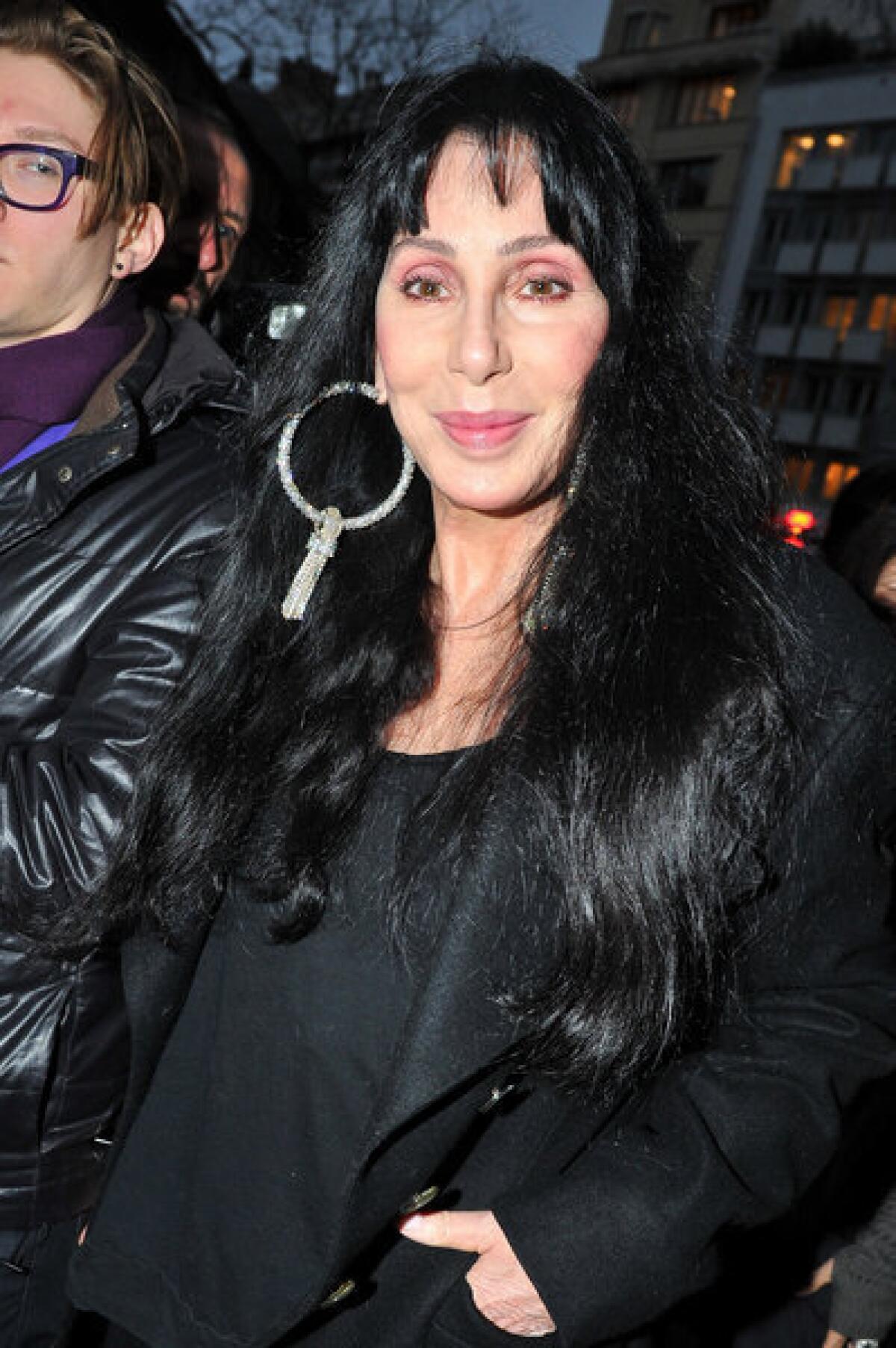 Cher attends a Paris fashion show.