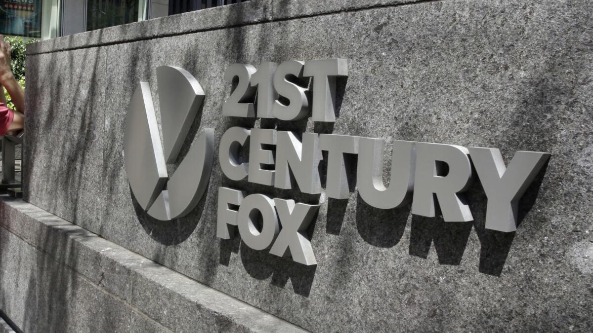 A 21st Century Fox sign can be seen outside the News Corp. headquarters building in New York.