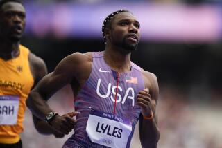 Noah Lyles, of the United States, competes during a heat in the men's 100-meter.