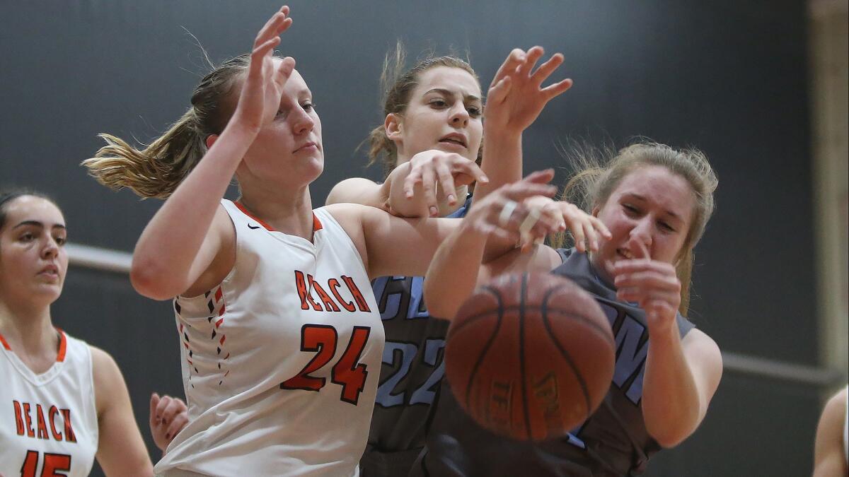 Huntington Beach High's Andie Payne (24), shown playing against Corona del Mar on Jan. 17, had nine points, 16 rebounds and three blocks Saturday night to help the Oilers girls' basketball team advance to the CIF Southern Section Division 2AA quarterfinals.