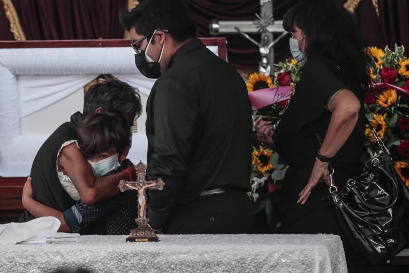 Los Angeles, CA, August 4, 2020 - Felipe Juarez, a victim of Covid-19, is memorialized at Continental's first outdoor service in compliance of a State and City mandates preventing indoor gatherings. In the throes of the Covid-19 epidemic Continental Funeral Home struggles to keep up with the demands of rising death rates in a community suffering with health and finances. (Robert Gauthier / Los Angeles Times)