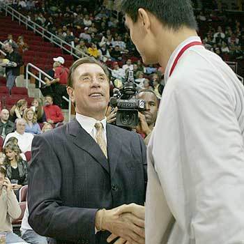 Los Angeles Lakers coach Rudy Tomjanovich shakes hands with Houston Rockets' Yao Ming in Houston. Tomjanovich, who played for the Rockets and later coached them to two NBA Championships, was honored before the game as he made his Houston debut as the Lakers' coach.
