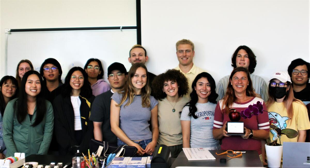 OCC biology professor Kelli Elliot, third from right, poses with students.