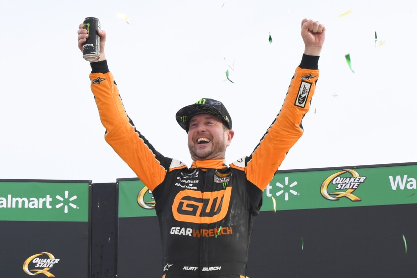 Kurt Busch celebrates in Victory Lane after winning a NASCAR Cup Series auto race, Sunday, July, 11, 2021, in Hampton, Ga. (AP Photo/John Amis)