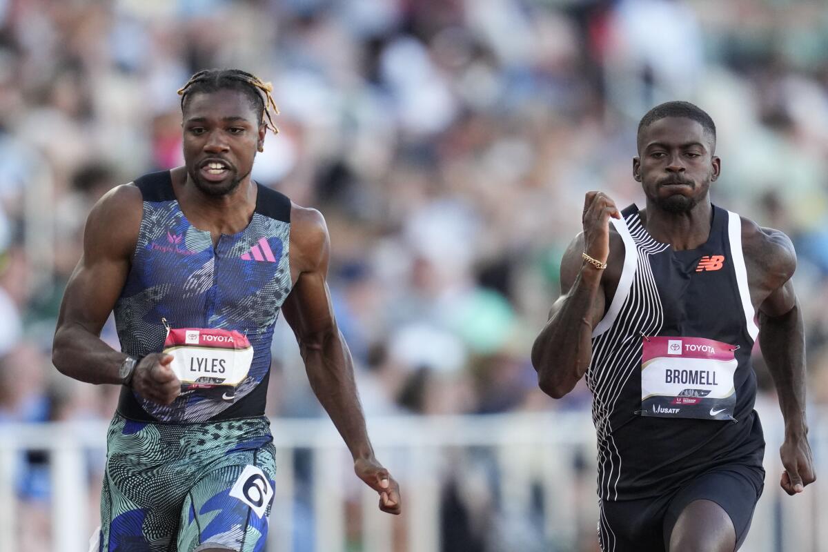 Noah Lyles, left, races ahead of Trayvon Bromell in the 100-meter dash semifinals at the U.S. track and field championships.