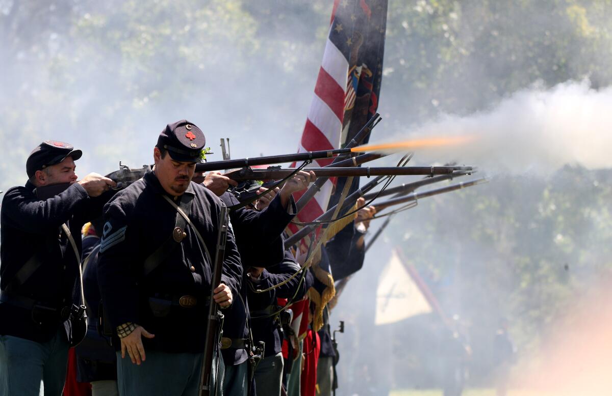 Union soldiers fire off a volley of shots toward the Rebel soldiers at the Civil War Days in 2019.