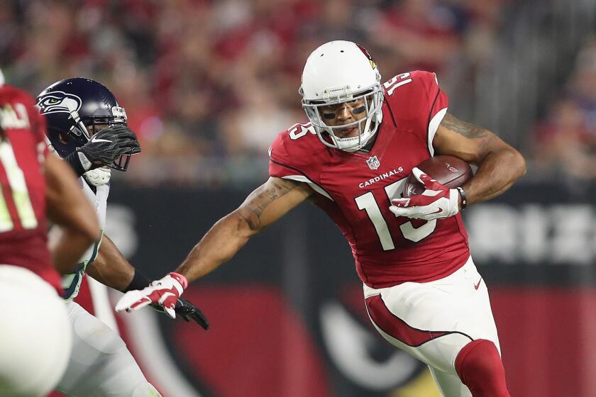 Cardinals receiver Michael Floyd (15) makes a reception during the first quarter against the Seattle Seahawks on Oct. 23.