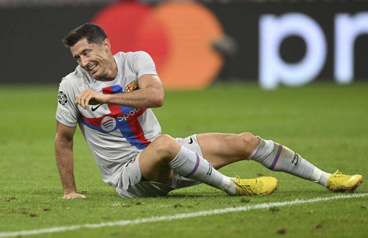 Barcelona's Robert Lewandowski reacts during the Champions League, group C soccer match between Bayern Munich and Barcelona at the Allianz Arena in Munich, Germany, Tuesday, Sept. 13, 2022. (AP Photo/Andreas Schaad)