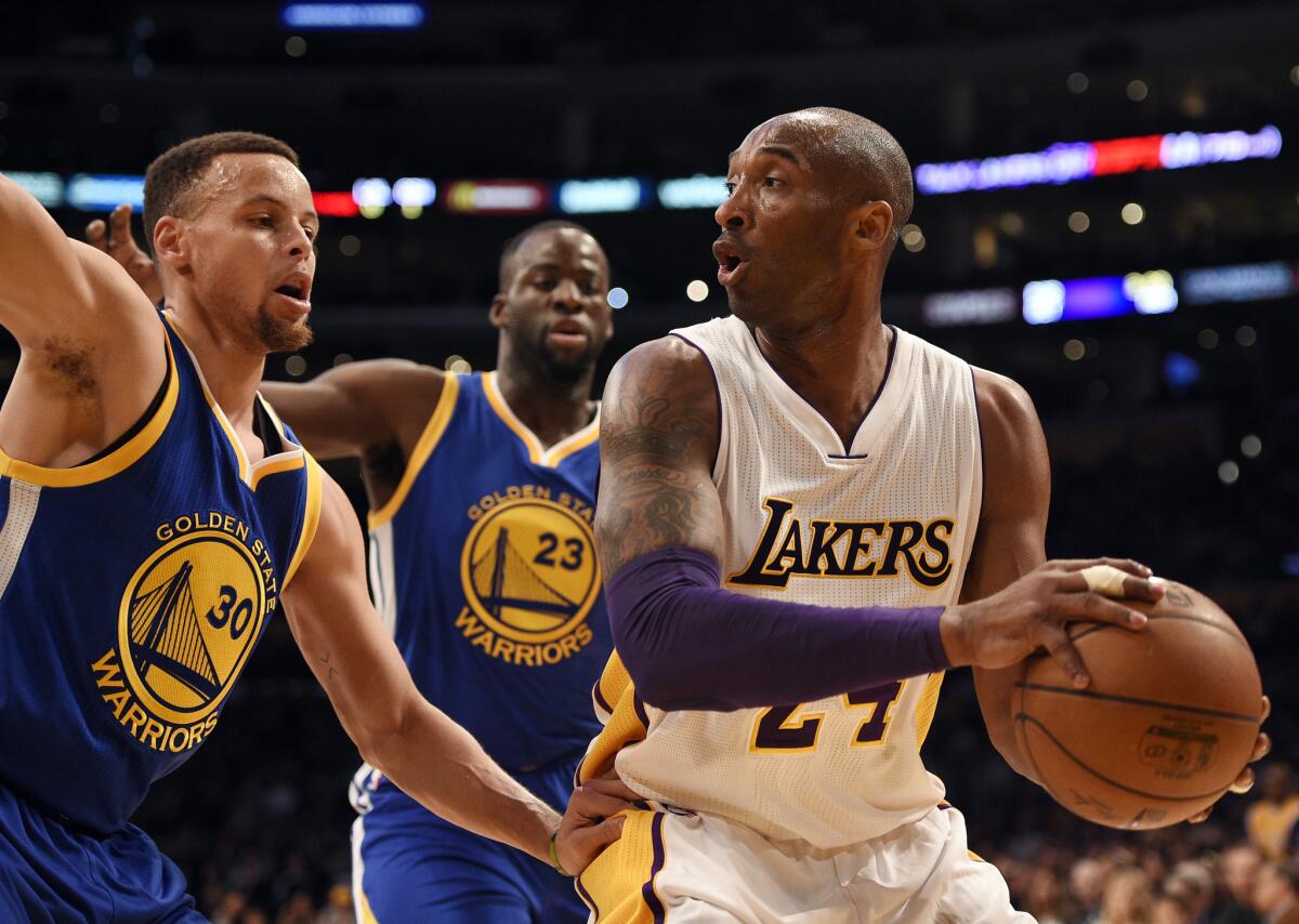 Kobe Bryant handles the ball under pressure by Golden State's Stephen Curry, left, and Draymond Green on March 6.