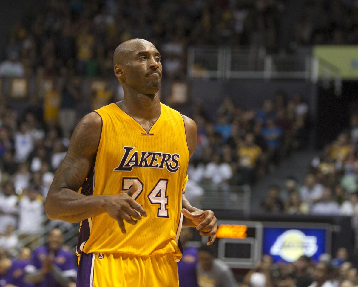 Kobe Bryant plays in an exhibition game against Utah on Oct. 6 in Honolulu.