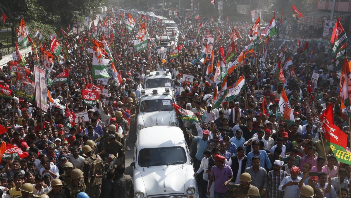 A convoy of cars topped with red beacons travels to an election event in Allahabad, India, in February.