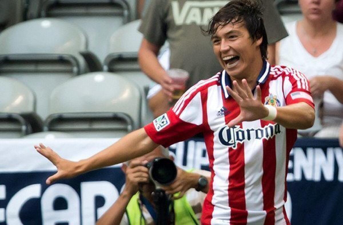 Chivas USA's Erick Torres celebrates after scoring against the White Caps with a bicycle kick in the first half Sunday in Vancouver.