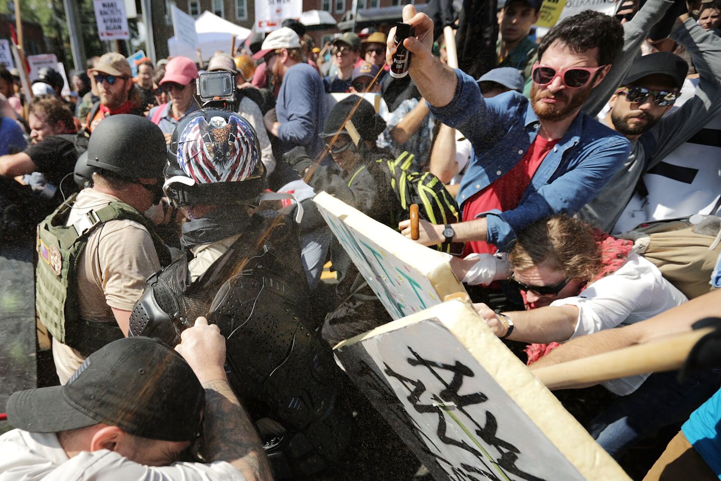 White nationalists, neo-Nazis and members of the "alt-right" clash with counter-protesters during a rally in Charlottesville, Va.