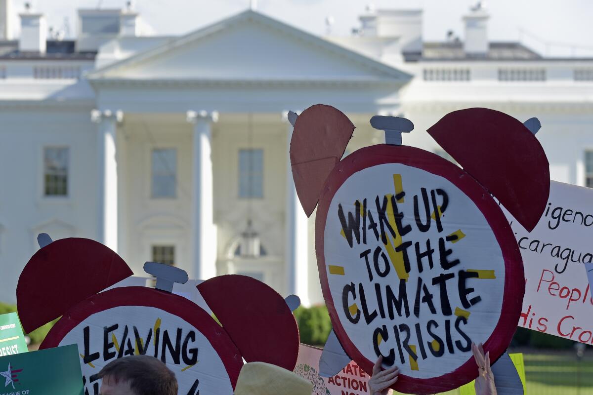 Climate protesters gather outside the White House in 2017.