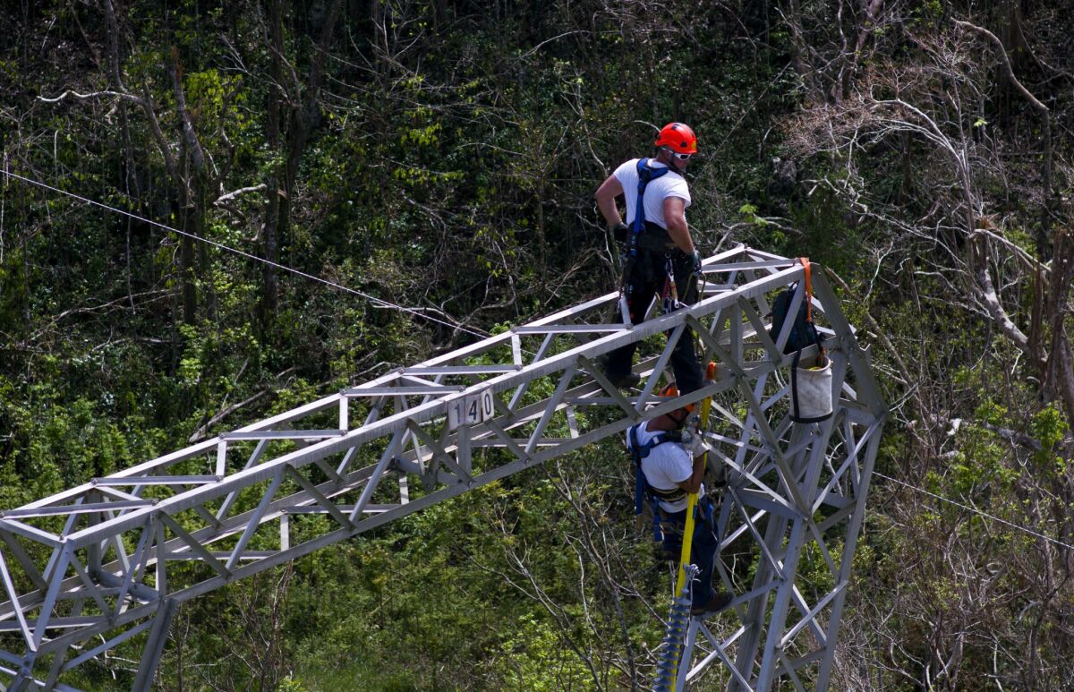 Whitefish Energy Holdings workers restore power lines damaged by Hurricane Maria in Barceloneta, Puerto Rico, on Oct. 15.