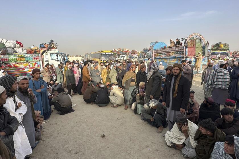 Afghans wait for clearance to depart for their homeland at a deportation camp set up by authorities to facilitate illegal immigrants, in Chaman, a town on the Pakistan-Afghanistan border, Wednesday, Nov. 1, 2023. Pakistani security forces on Wednesday rounded up, detained and deported dozens of Afghans who were living in the country illegally, after a government-set deadline for them to leave expired, authorities said. (AP Photo/Habibullah Achakzai)
