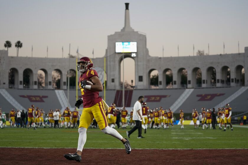 Southern California wide receiver Bru McCoy (4) warms up before an NCAA college football game for the Pac-12 Conference championship against Oregon Friday, Dec 18, 2020, in Los Angeles. (AP Photo/Ashley Landis)
