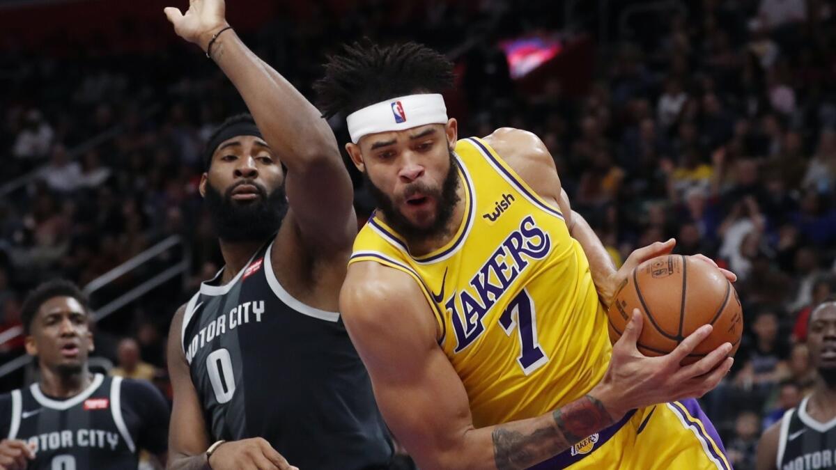 Lakers center JaVale McGee grabs a rebound against Detroit Pistons center Andre Drummond, who got 23 of them against the Lakers.