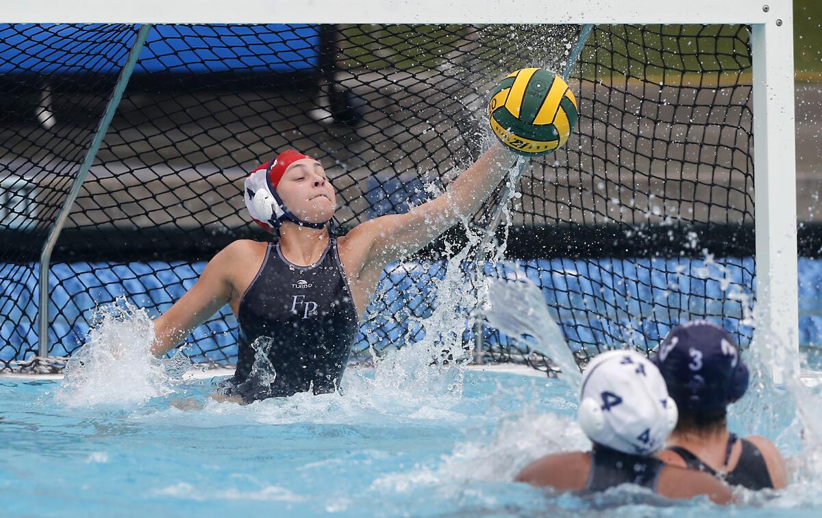 Flintridge Prep goalkeeper Lauren Bennett makes a save against Marina during the first half in the CIF Southern Section Division VI championship match at Woollett Aquatics Center in Irvine on Saturday.